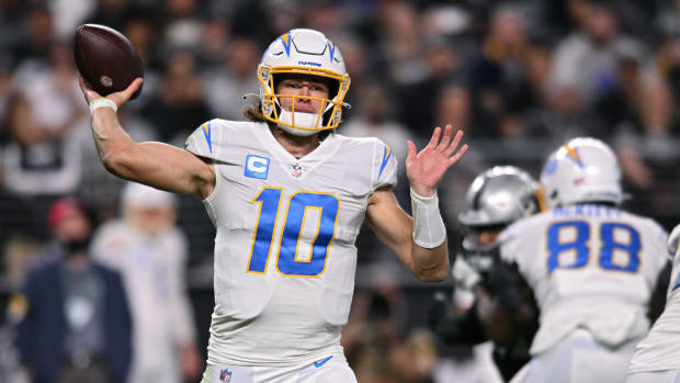 Jan 9, 2022; Paradise, Nevada, USA; Los Angeles Chargers quarterback Justin Herbert (10) throws a pass against the Las Vegas Raiders during the second half at Allegiant Stadium. Mandatory Credit: Orlando Ramirez-USA TODAY Sports